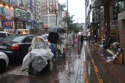 Umbrella vendor in the rain
